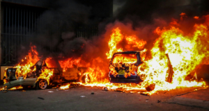 https://unsplash.com/photos/cars-are-engulfed-in-flames-and-smoke-hPJZ9IMKYYY